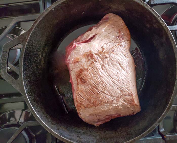 Beef roast cooking on top of the stove