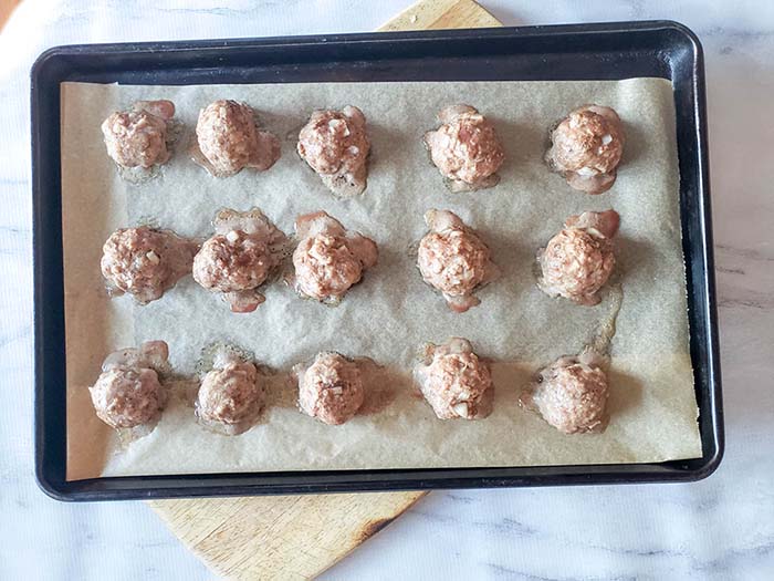 baked meatballs on baking sheet