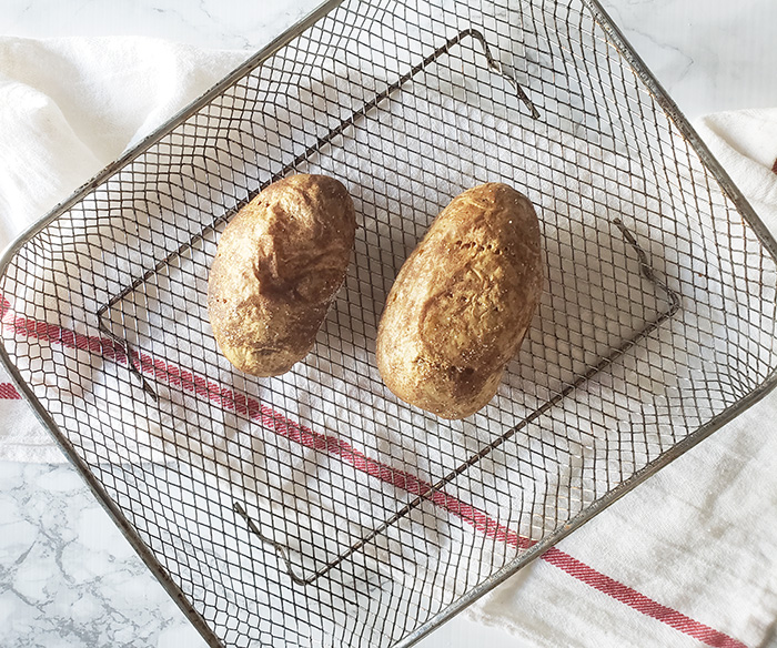 Air Fryer Baked Potatoes Cooked in air fryer tray