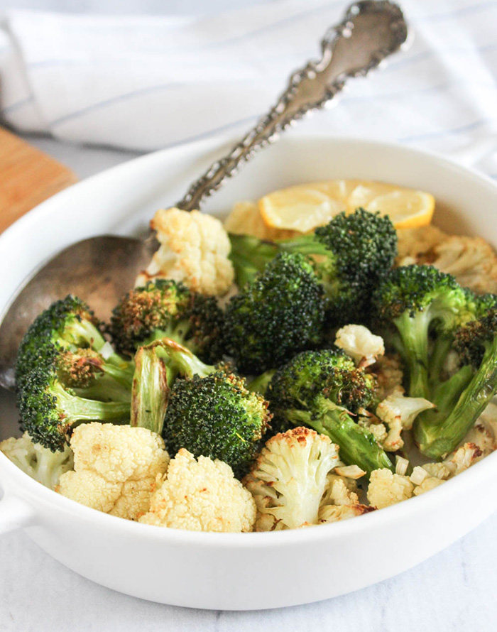 air fried broccoli and cauliflower in a white bowl