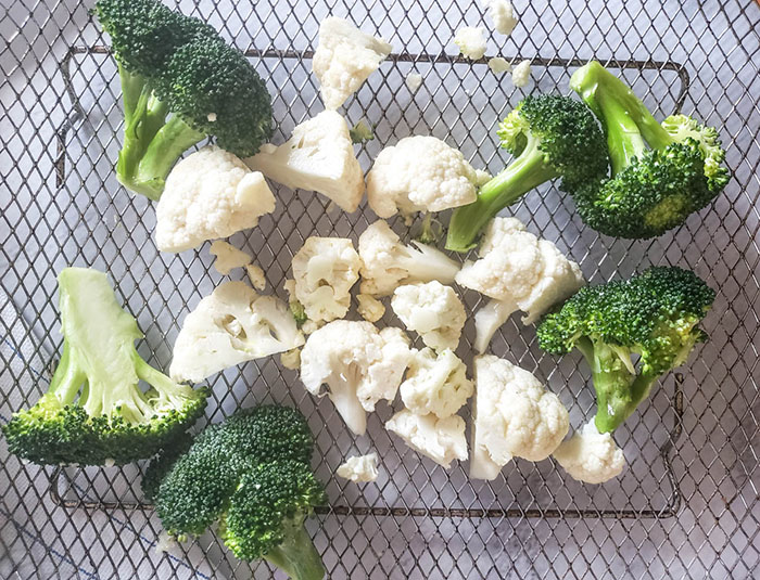 broccoli and cauliflower on an air fryer try before cooking it