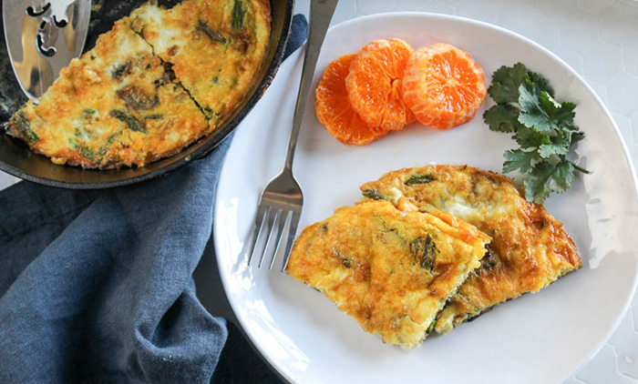 overhead view of two slices of frittata on a plate