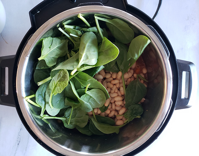 spinach and white beans in an instant pot