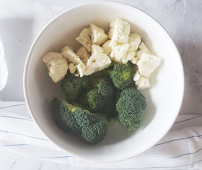 broccoli and cauliflower in a white bowl