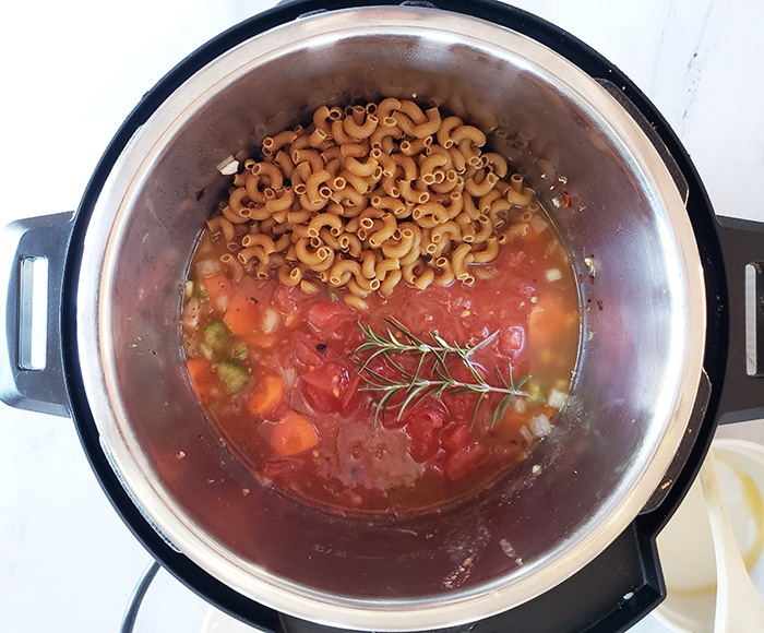 All ingredients in an instant pot ready to be cooked