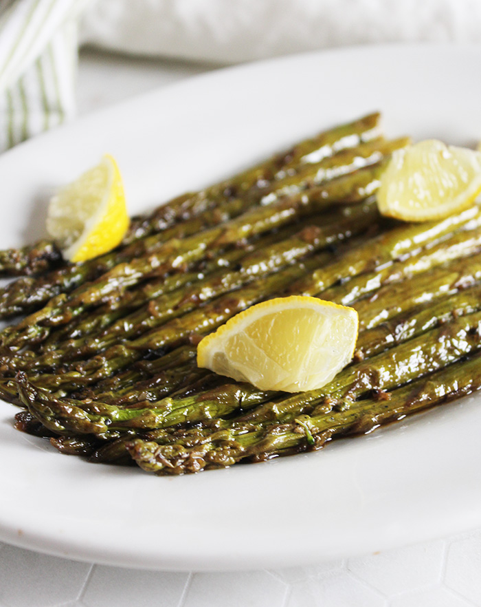 Asparagus on a plate with lemon