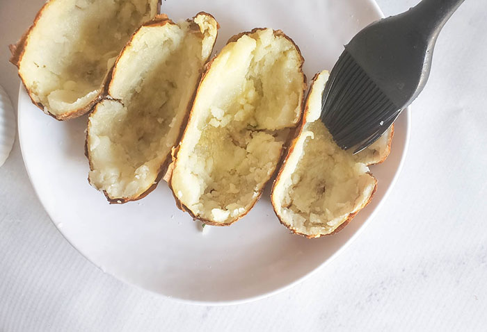 a pastry brush brushing on oil