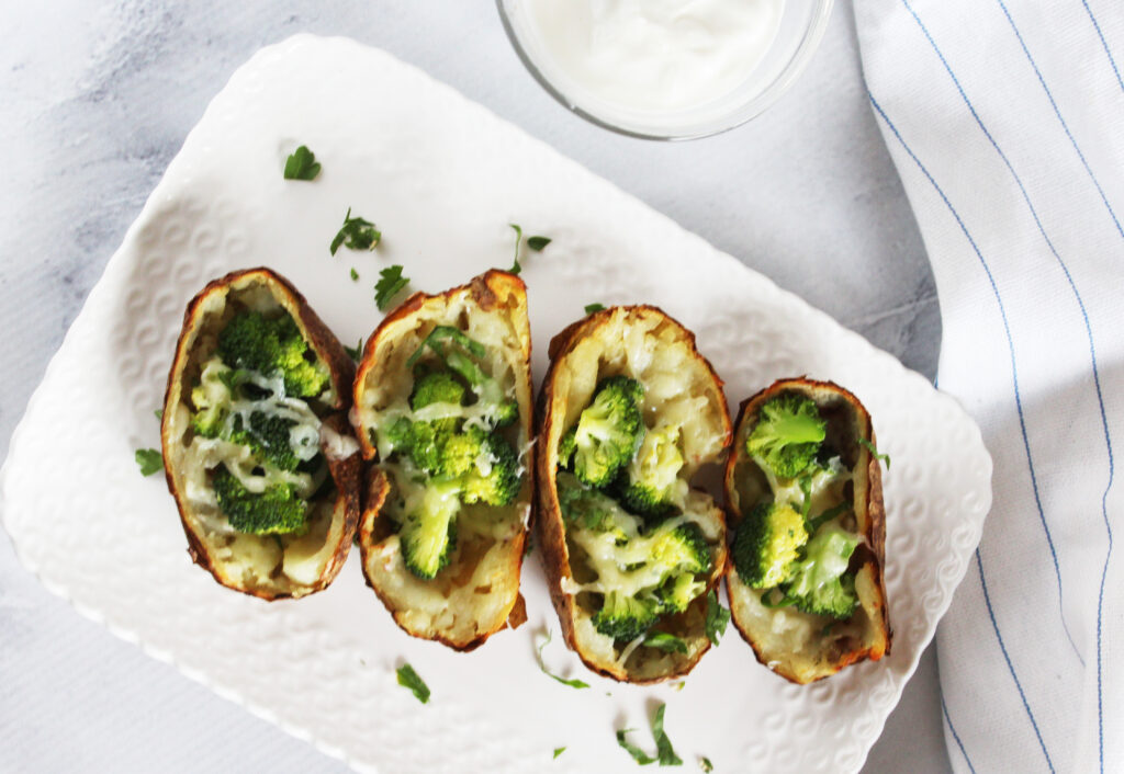 overhead view of potato skins with broccoli and melted cheese