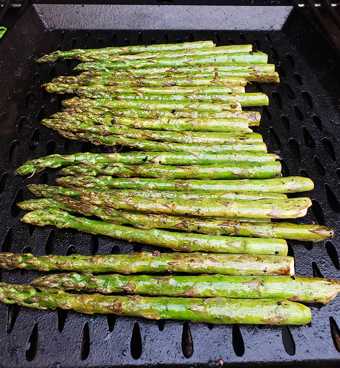 asparagus cooking on a grill