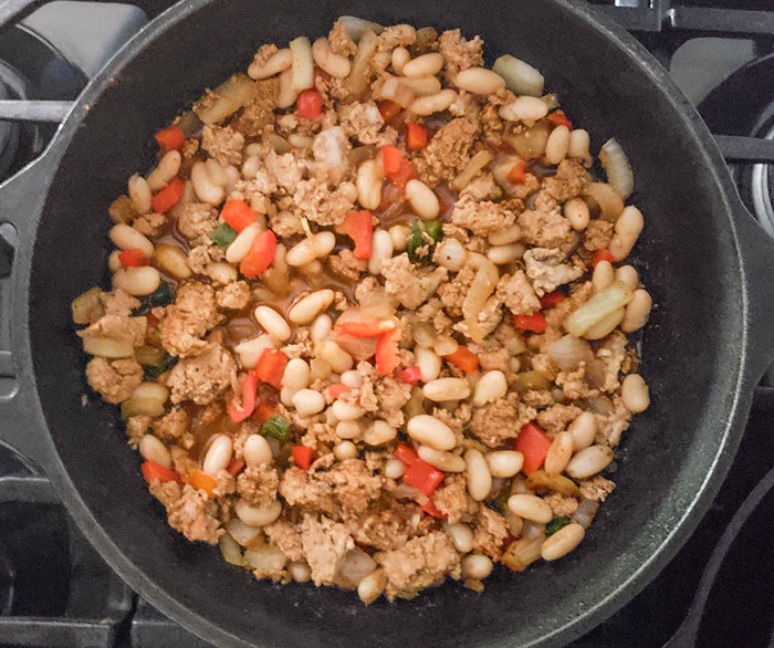 turkey chili beans cookign in a pot with broth