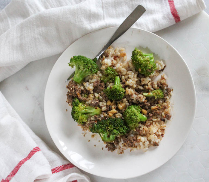 overhead view of ground beef and broccoli on a plate