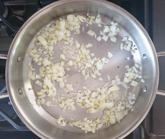 Process onions and garlic cooking in a skillet