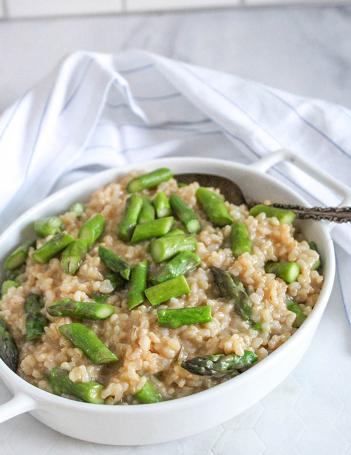 a photo of instant pot brown rice risotto with asparagus