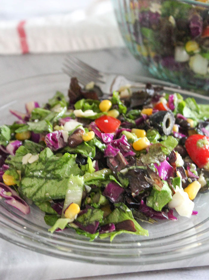 Mexican chopped salad on a plate with a fork