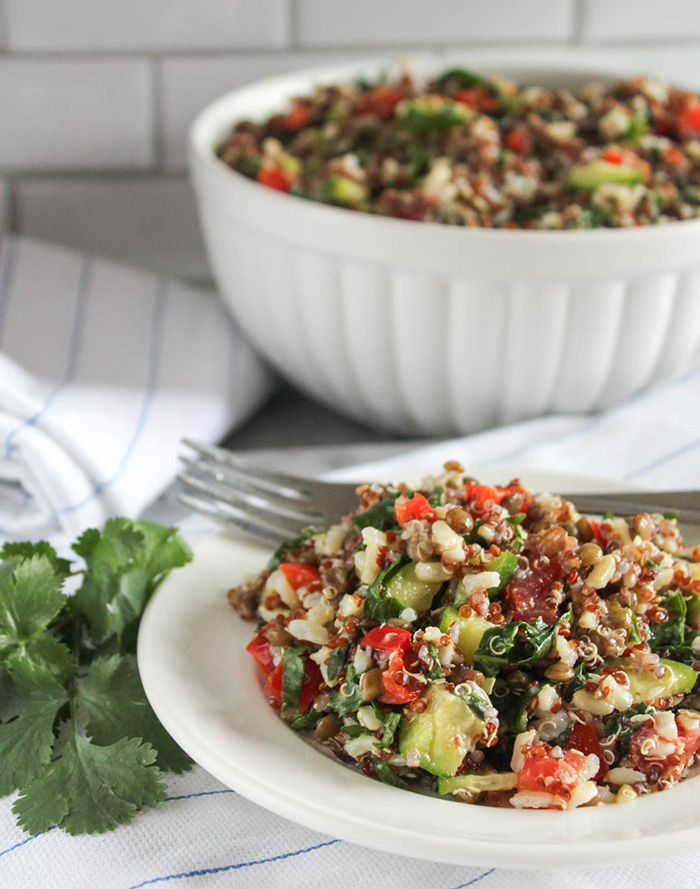 quinoa salad on a plate with a fork