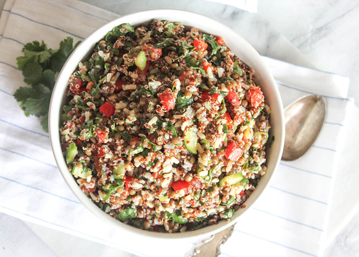 Overhead photo of quinoa salad with a spoon on the side