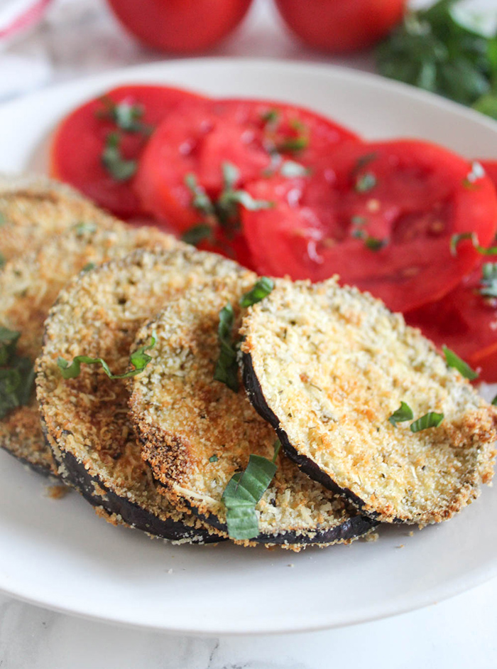 a close up of breaded eggplant on a plate