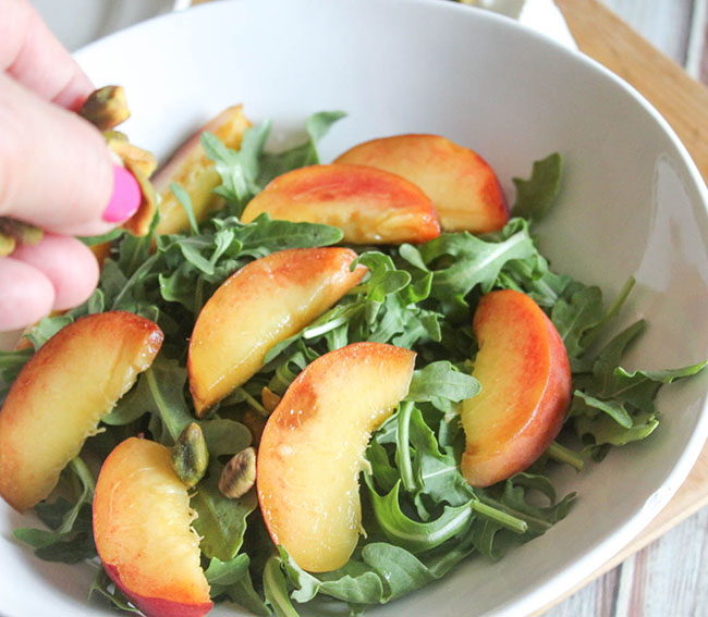 adding cheese to salad