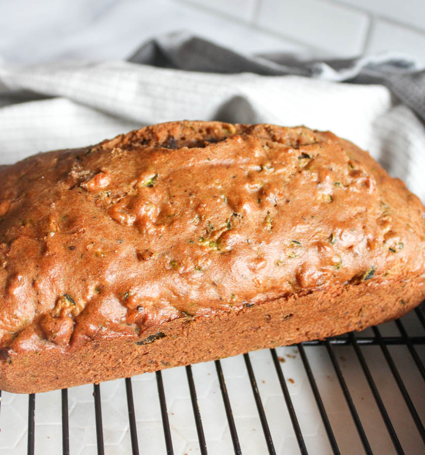 zucchni bread cooling on a rack