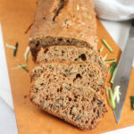 zucchini bread sliced on a cutting board