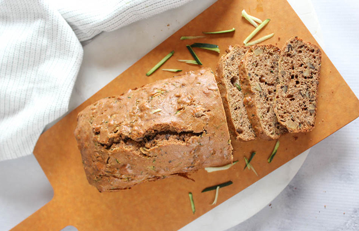 overhead view of zucchini bread on a cutting board