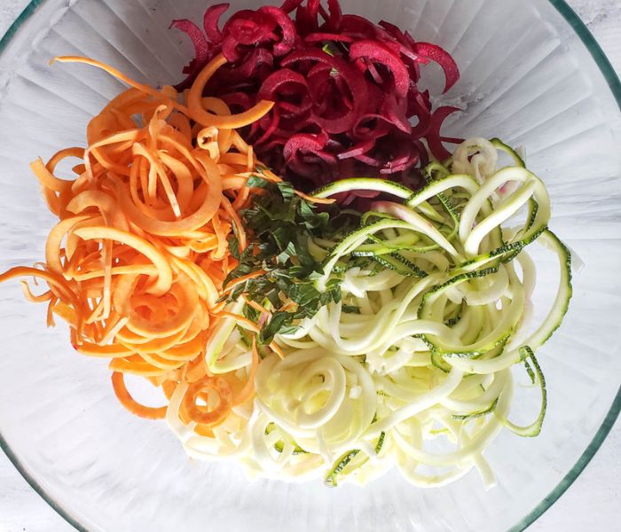 spiral veggie salad step 2 adding herbs