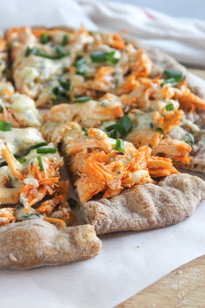 close up of buffalo chicken flatbread pizza