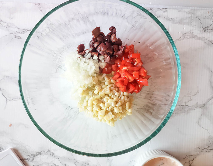 vegetable ingredients for mexican macaroni salad in a bowl