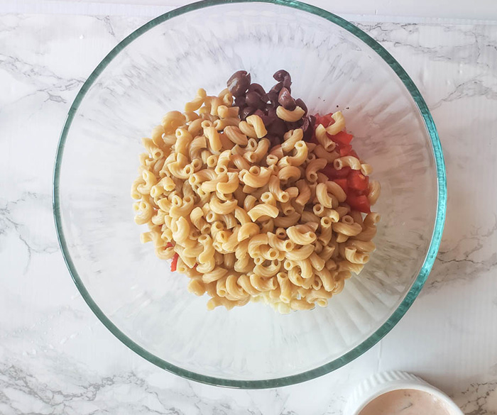 macroni and vegetables in a bowl