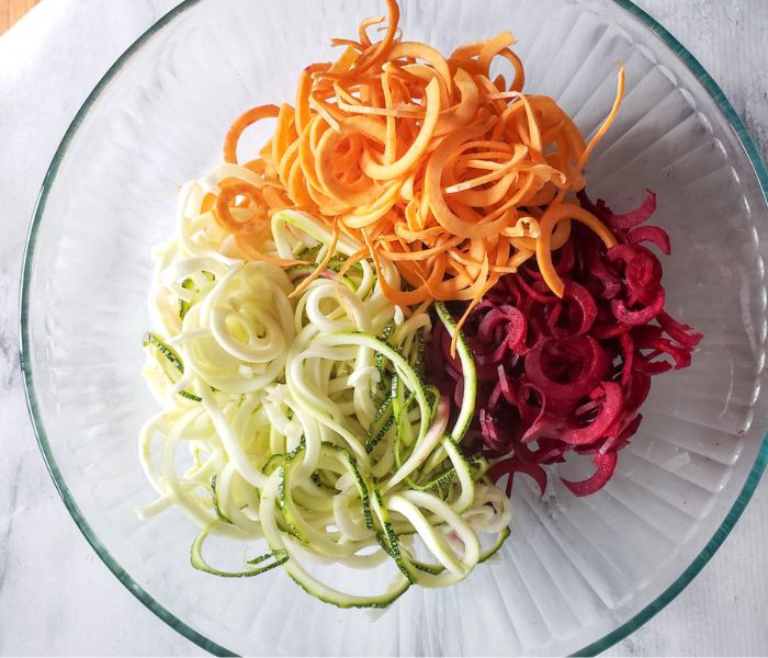 process step one spiraled veggies in a bowl