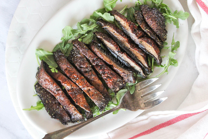 overhead view of sliced mushrooms on a plate