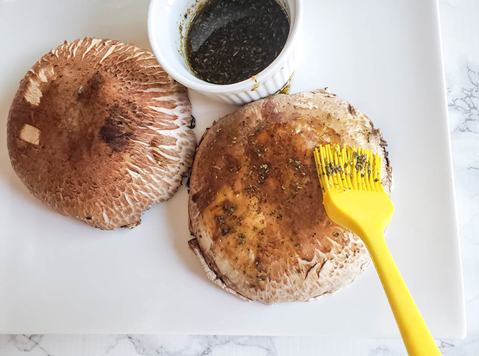 process step one, brushing oil mixture onto mushrooms