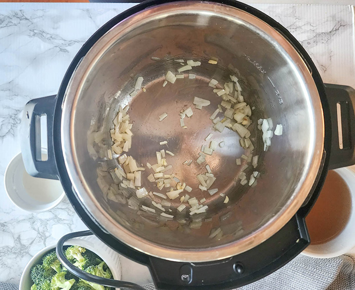 overhead view of process cooking onions in Instant Pot