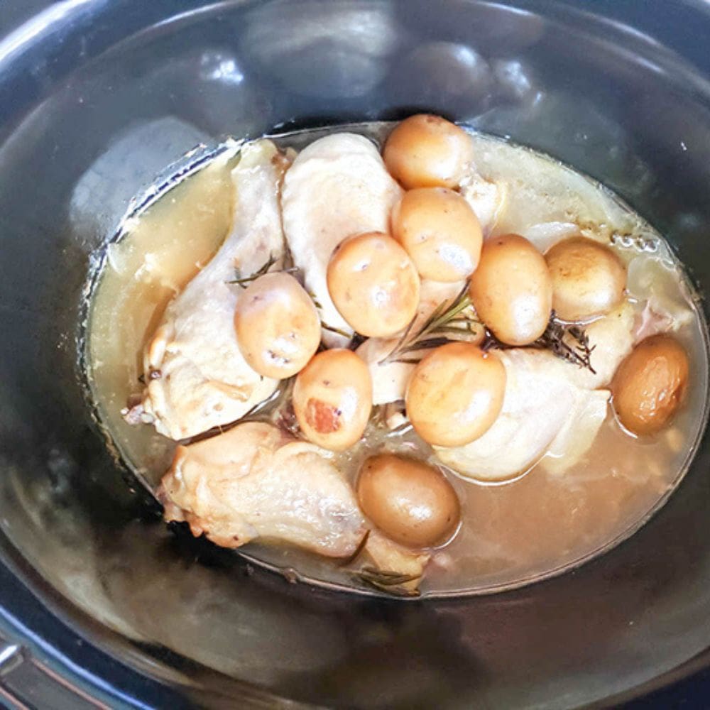 step 4 completed chicken legs cooked in gravy in crockpot