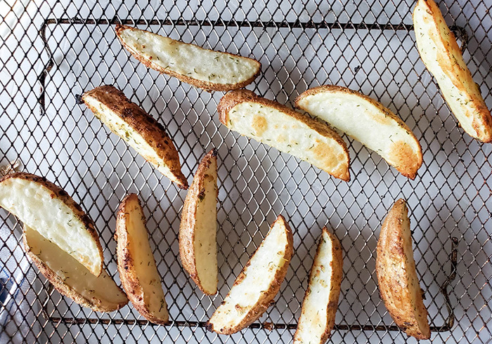 Steak fries cooked on an air fryer tray