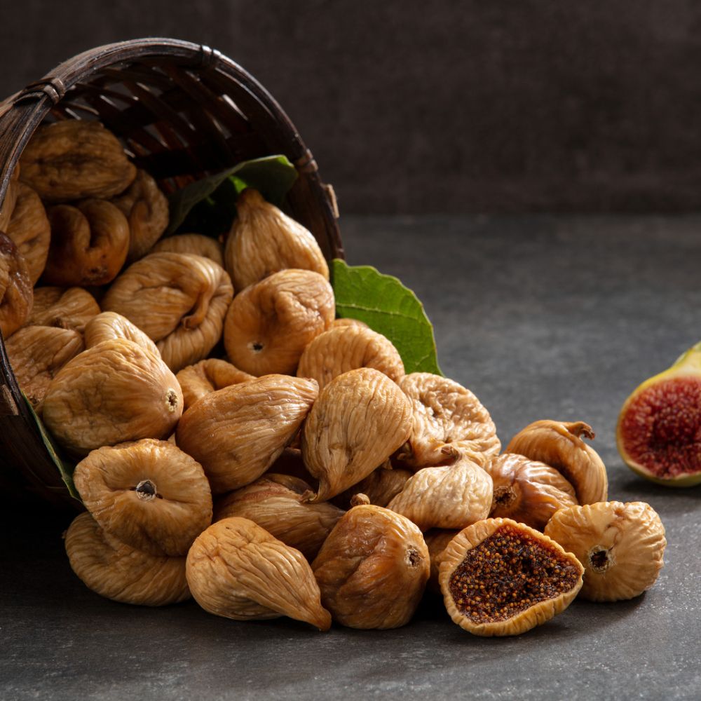 a basket with figs pouring out