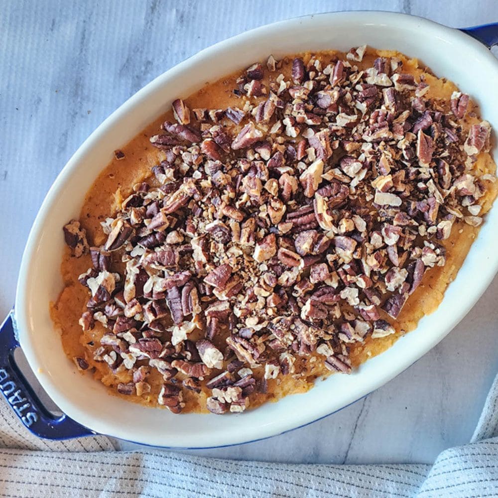 sweet potato casserole in a casserole dish and ready for the oven