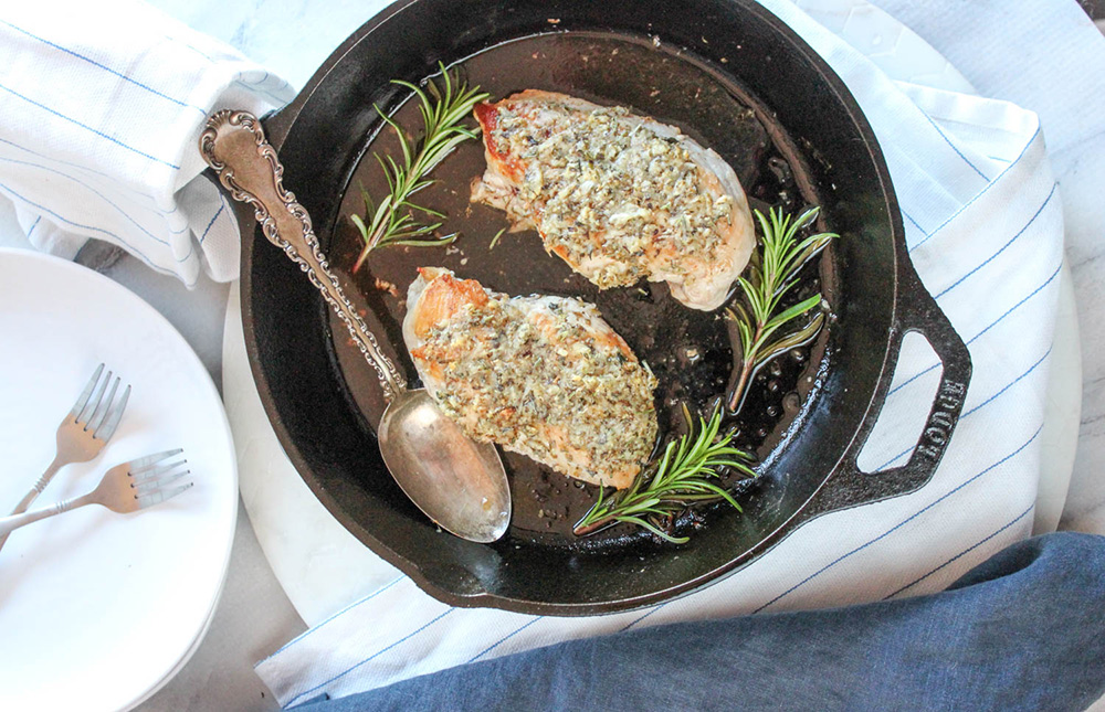 an overhead view of chicken savoy in a skillet