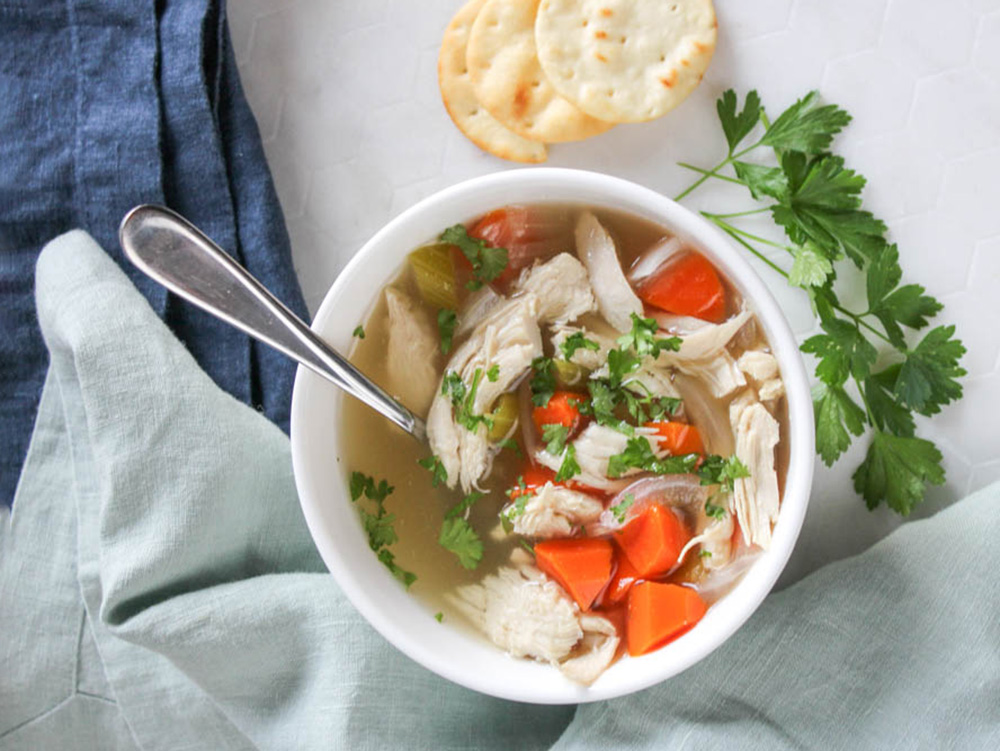 overhead view of chicken soup in a bowl