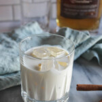 a close up picture of bourbon cream in a glass with ice