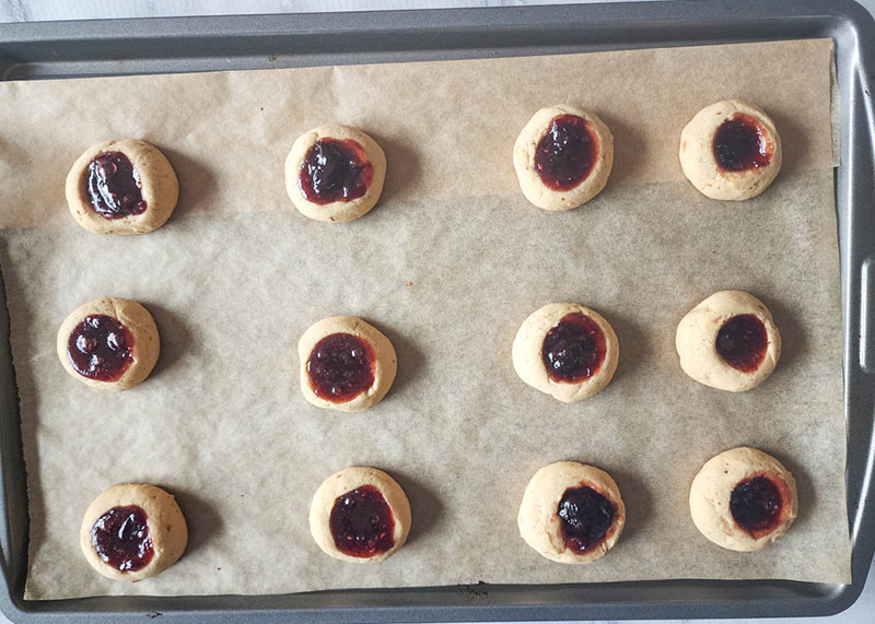 butter cookies on a baking sheet ready to be baked