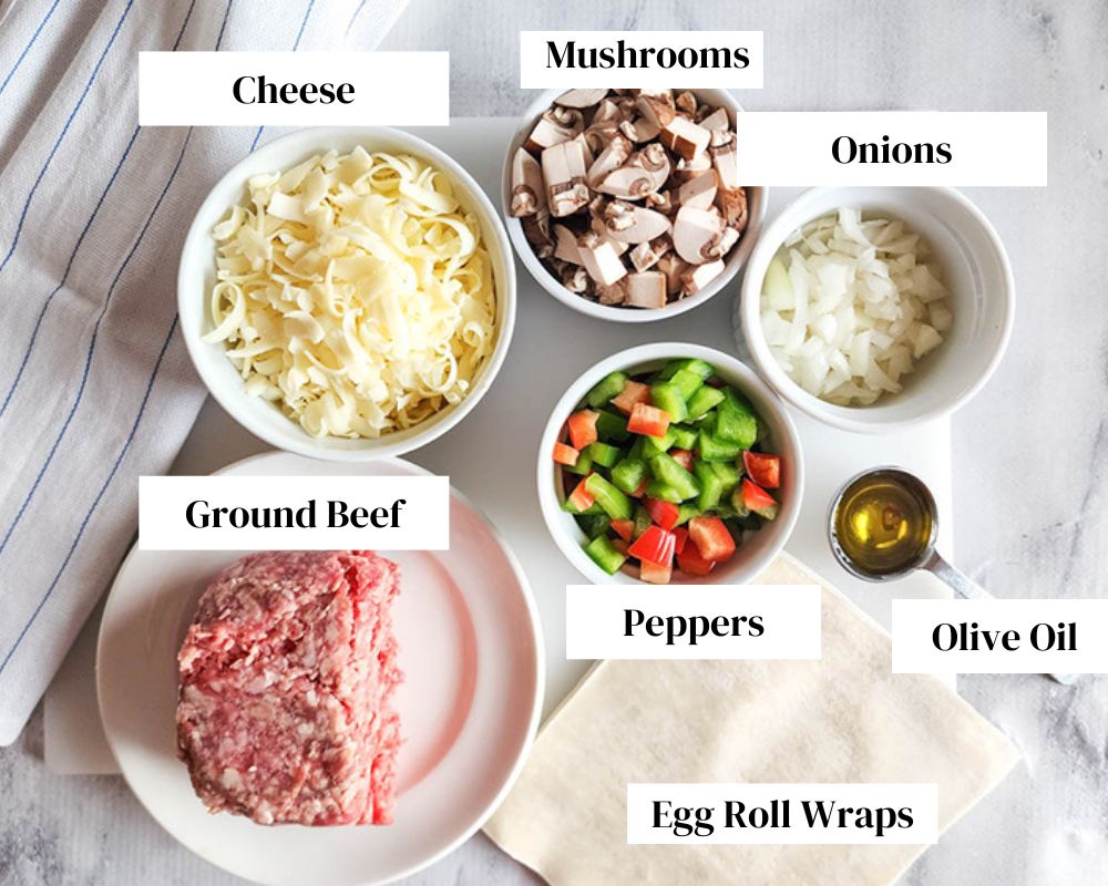 a picture of the ingredients needed to make philly cheese steak egg rolls
