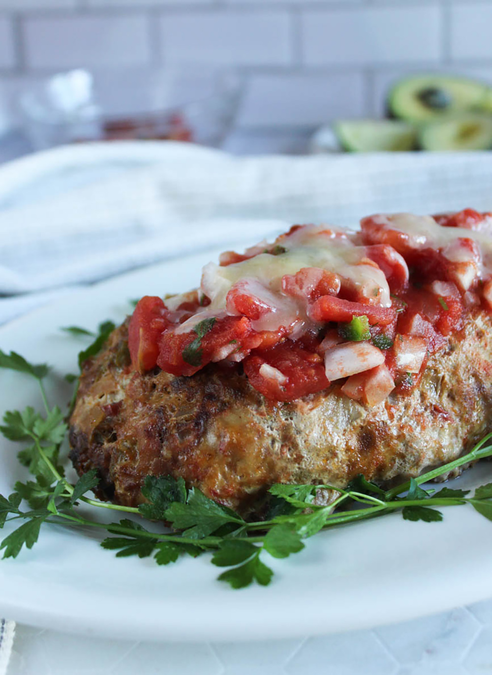 cooked turkey meatloaf on a platter with parsley