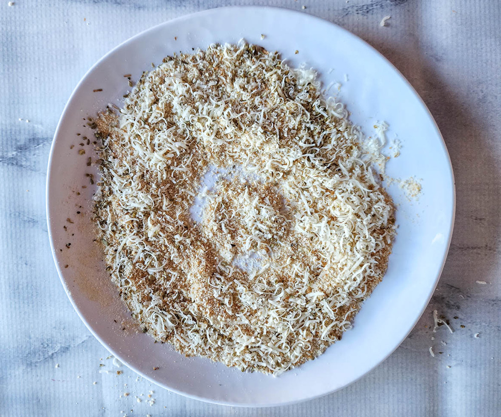 process of bread crumbs mixed with cheese and spices