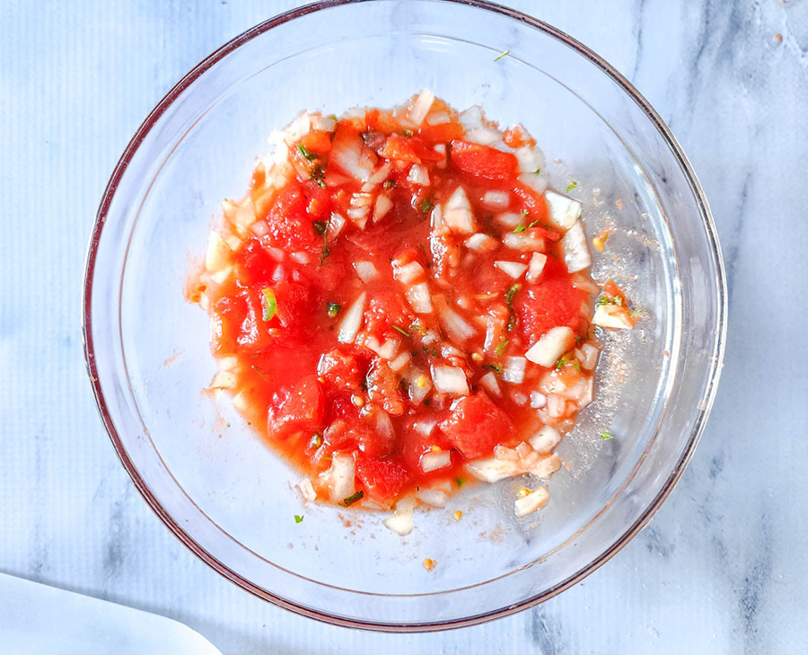 chopped tomatoes onions and peppers in a bowl