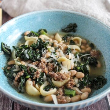 a close up picture of sausage kale soup