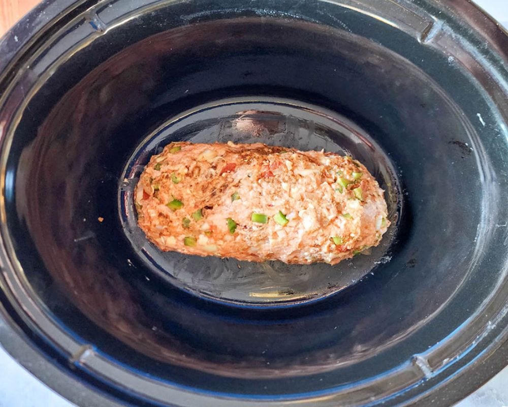 Slow cooker tex mex meatloaf step 3, uncooked meatloaf in a slow cooker