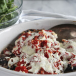 a close up of stuffed mushrooms portobello in a casserole