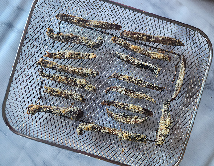 mushroom fries cooked on an air fryer tray