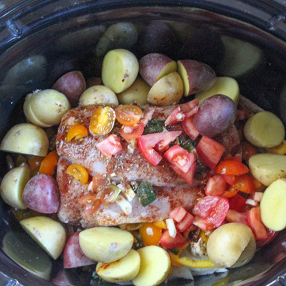 a picture of all of the ingredients for chipotle chicken stew in a slow cooker, ready to cook